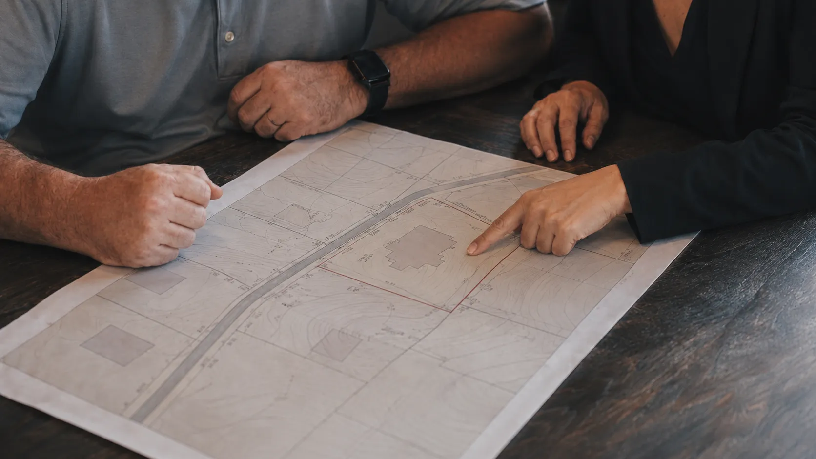 Reviewing building plans at the drafting table